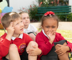 Children signing name in British Sign Language